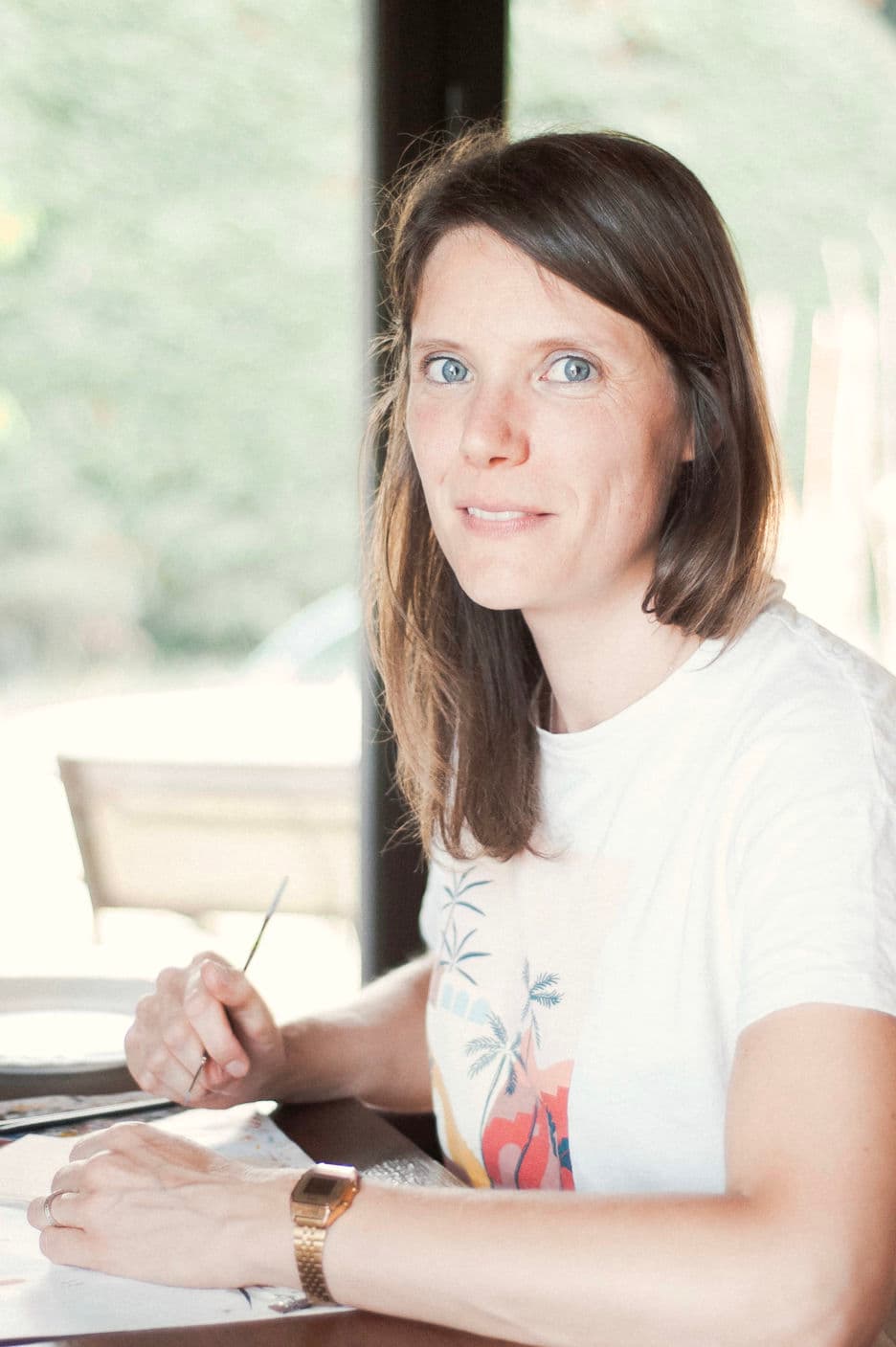 Manon working at her desk